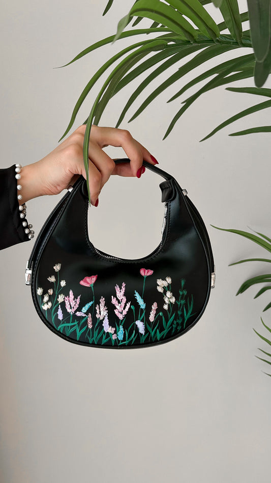 Floral collection black rounded leather hand bag