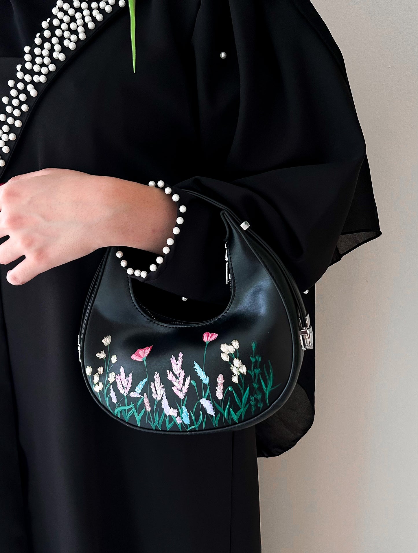 Floral collection black rounded leather hand bag